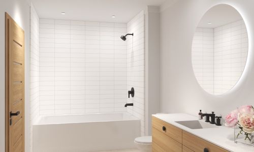 Mostly white bathroom with tiled shower